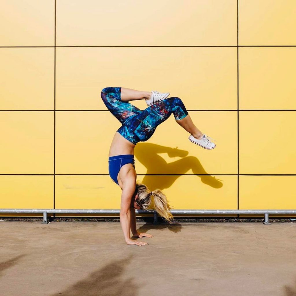 yellow background handstand - square image